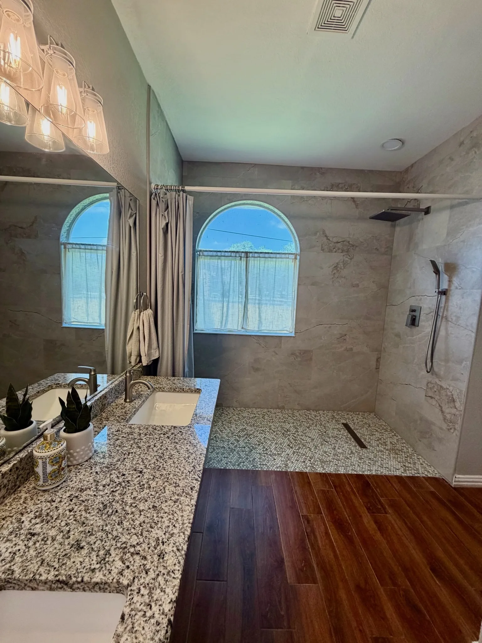 Walk-in shower with grab bar and shower chair